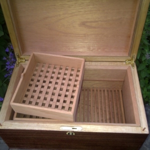 removable half trays up top, crumb catcher in bottom. 3/8" Spanish Cedar Lining