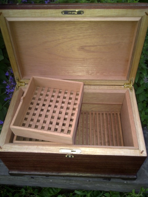 removable half trays up top, crumb catcher in bottom. 3/8" Spanish Cedar Lining